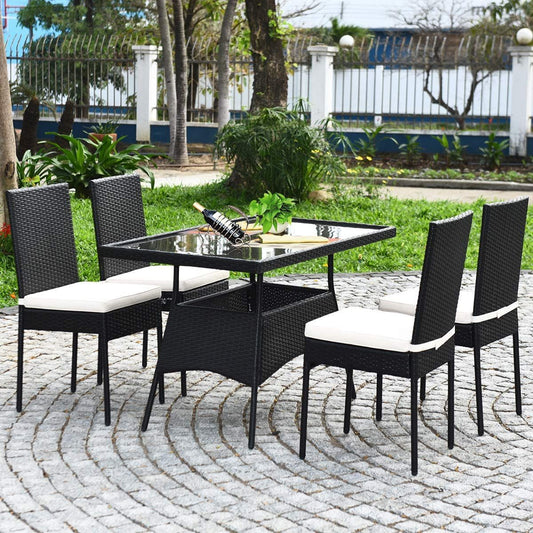 Experience Outdoor Dining Bliss: 5-Piece Patio Rattan Dining Set with Tempered Glass Top and Removable Cushions