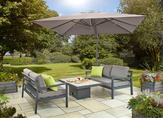 Elevate your outdoor entertaining with the Tutbury Dual Height Rectangular Table Garden Set, featuring two sofas for comfortable seating. Whether it's a casual brunch or an evening cocktail party, this set offers versatile seating options. Crafted with durable materials, elevate your outdoor experience with this stylish and functional garden set. Explore our collection for premium outdoor furniture designed to enhance your outdoor living